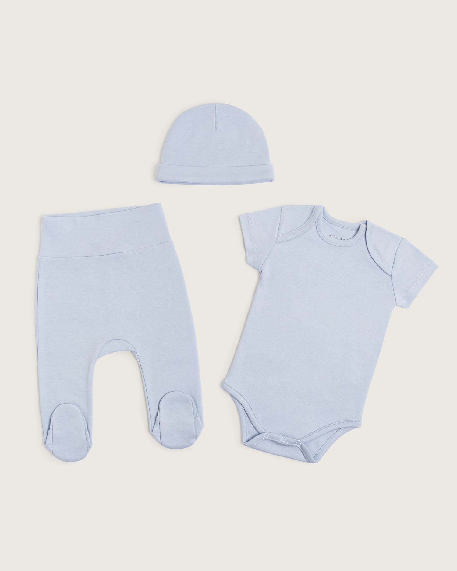 Set body manga corta, pantalón con pie y gorro de bebé · Celeste · Pima orgánico GOTS